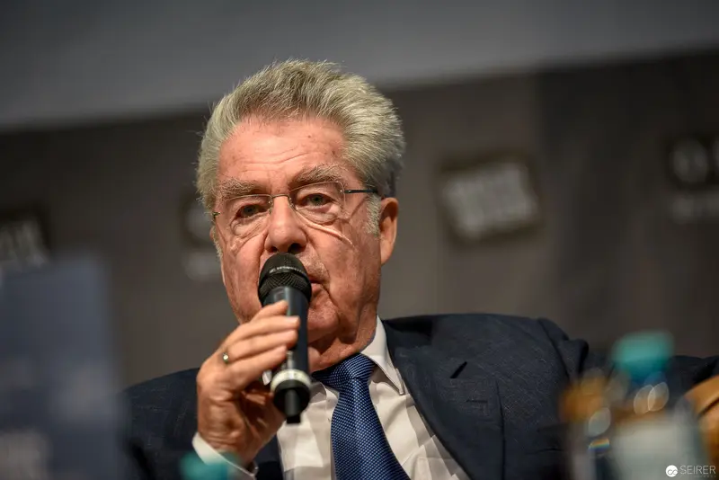 Heinz Fischer, Former Austrian President, Speaking at Public Event with Microphone