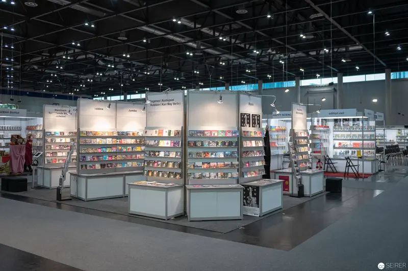 International Book Fair Display: Illuminated Exhibition Stands in Modern Convention Space