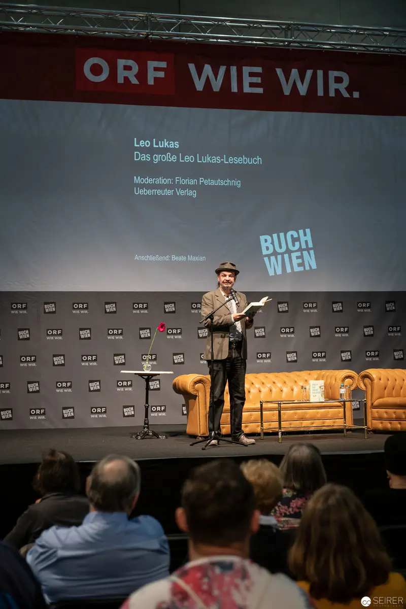 Leo Lukas Presenting at Buch Wien Literary Event on Stage