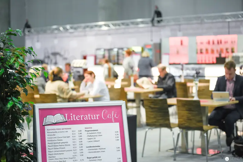 Literatur Cafe Menu Display in Contemporary Academic or Conference Space