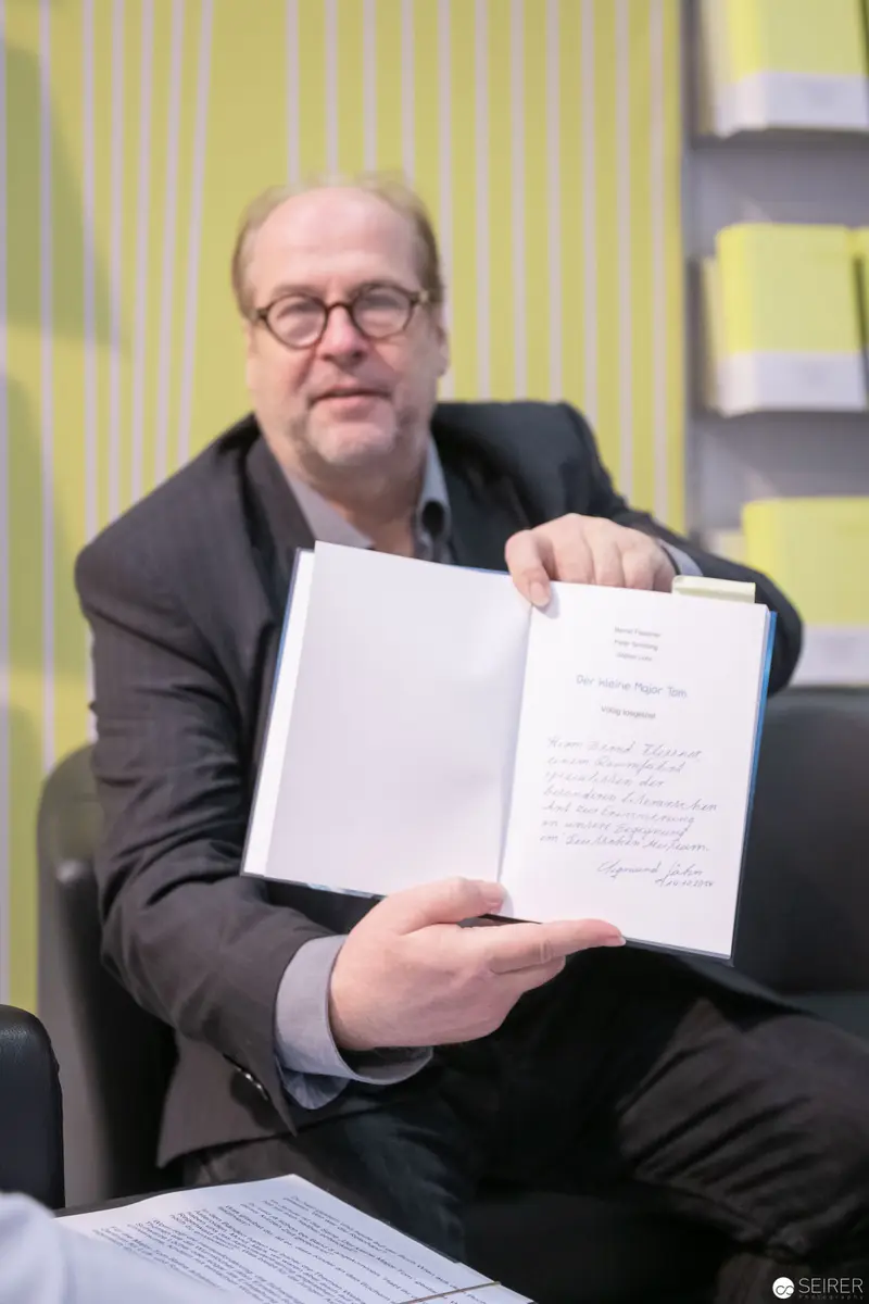 Bernd Flessner Presenting "Der kleine Major Tom" at Book Event