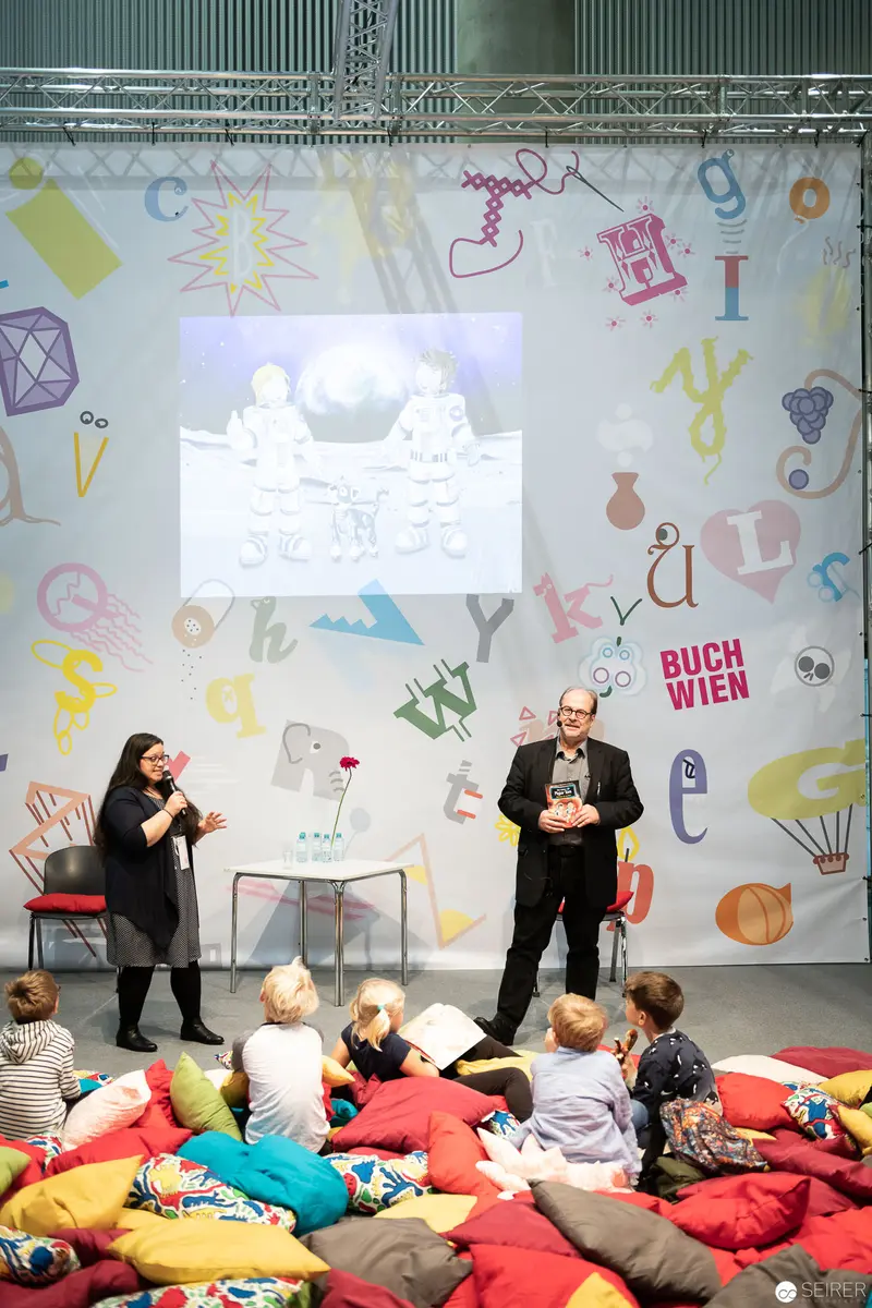 Bernd Flessner Presenting "Der kleine Major Tom" at Buch Wien Children's Event