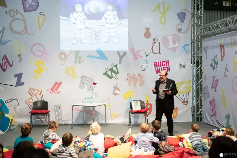 Bernd Flessner Presenting "Der kleine Major Tom" at Buch Wien Children's Event