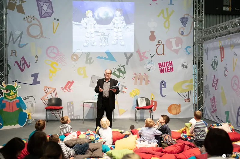 Bernd Flessner Presenting "Der kleine Major Tom" at Buch Wien Children's Event
