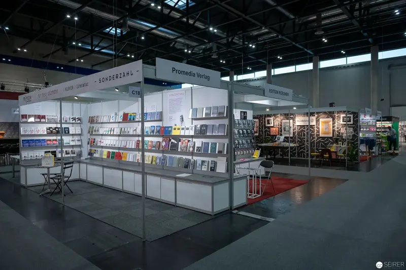 Book Fair Exhibition Stand with Modular Display Shelving and Promotional Materials