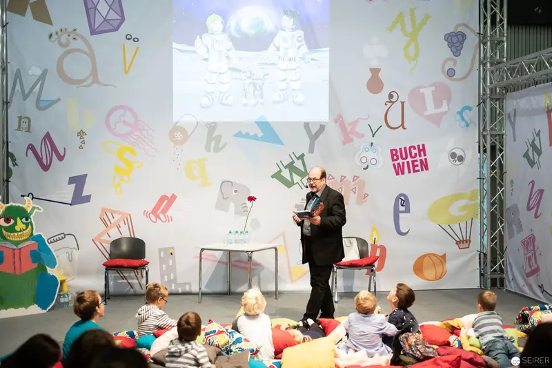 Buch Wien Children's Literature Event with Storyteller on Colorful Stage