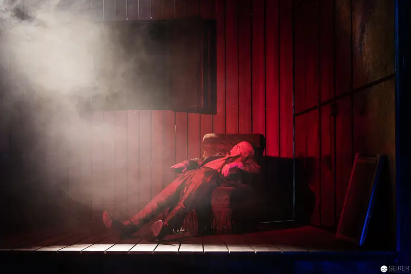 Lakrimosa's Dramatic Red Stage Scene with Mysterious Smoky Atmosphere