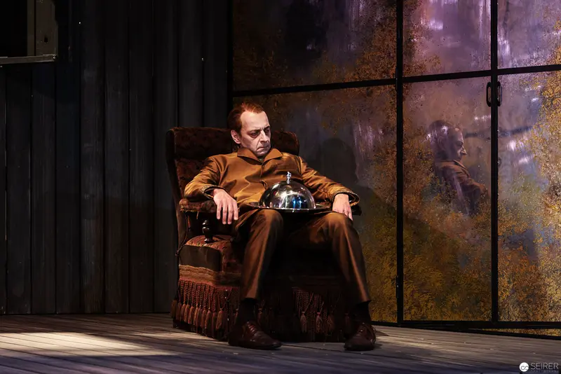 Lakrimosa's Vetter Ajaxerle in Contemplative Solitude on Ornate Stage Set