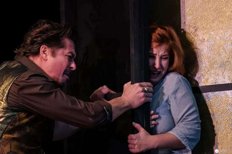 Intense Confrontation Between Male and Female Performers in Dramatic Theatrical Scene
