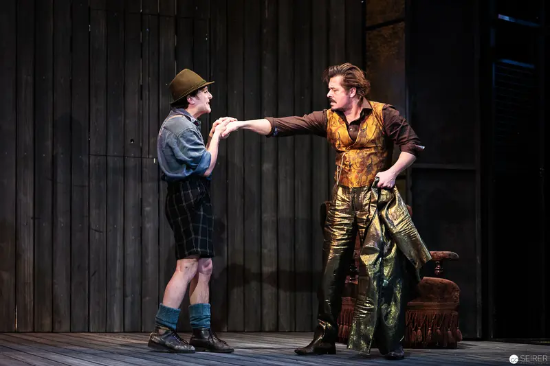 Theatrical Scene with Two Performers in Stylized Period Costumes