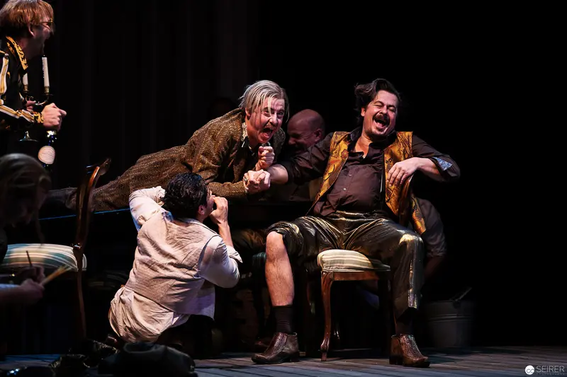 Theatrical Scene of Comedic Interaction between Characters from Fortunatus Wurzel Production
