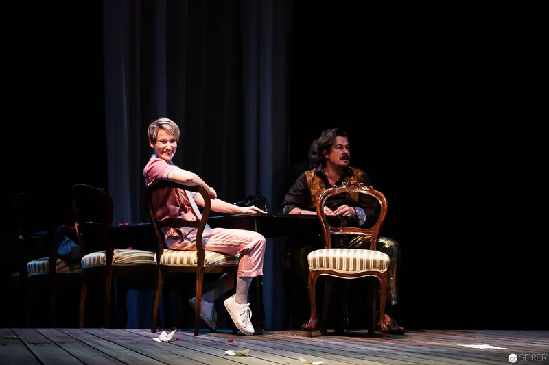 Alexandra Krismer and Patrick Seletzky in Theatrical Performance on Striped Chairs