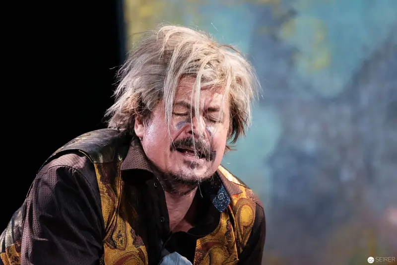 Performer in Emotional Performance with Windswept Hair and Intense Expression