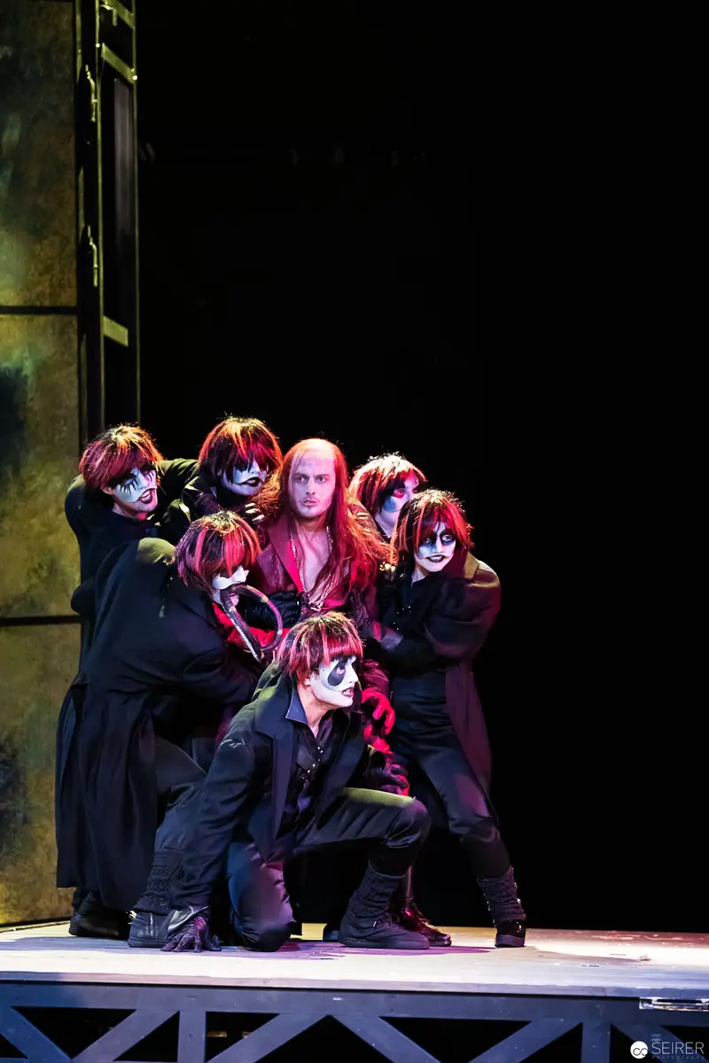 Theatrical Ensemble in Dramatic Pose from Theatrical Performance Lakrimosa