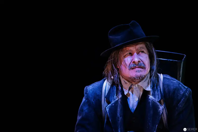Wolfgang Hübsch as Theatrical Character in Blue Velvet Coat and Black Hat