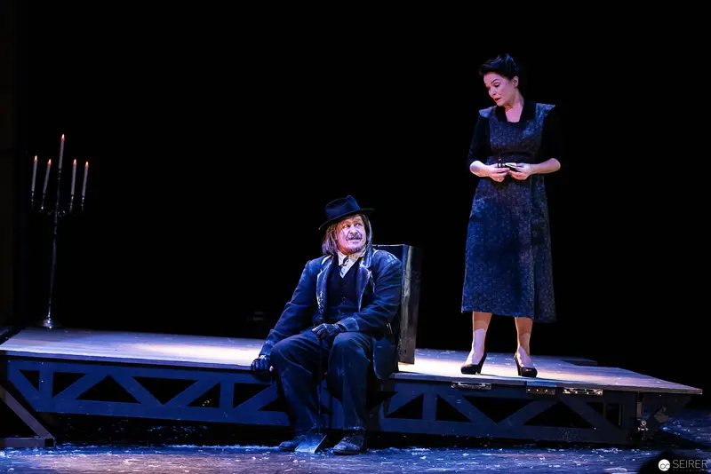 Lakrimosa and Bustorius on Staged Platform during Theatrical Performance