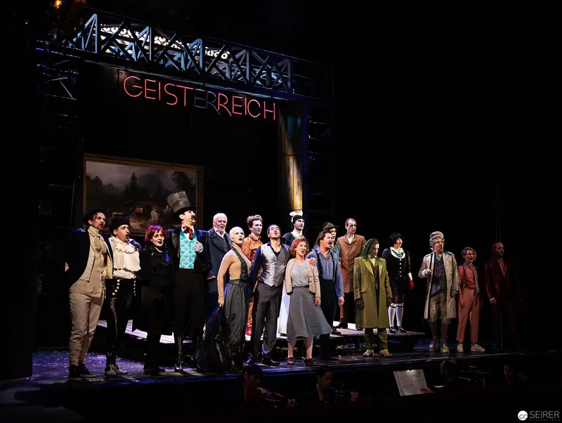 Geist-Reich Theatre Production Ensemble in Full Stage Tableau with Dramatic Lighting