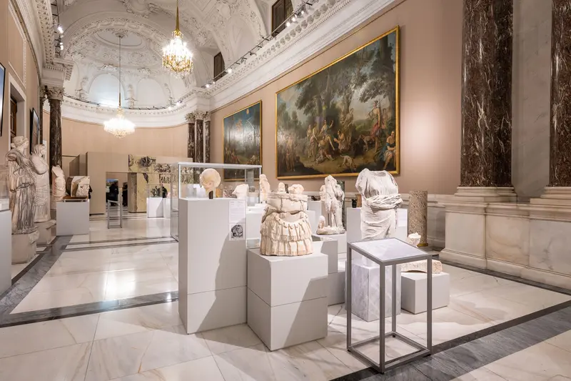 Marble Sculptures and Baroque Paintings in Elegant Museum Gallery Space