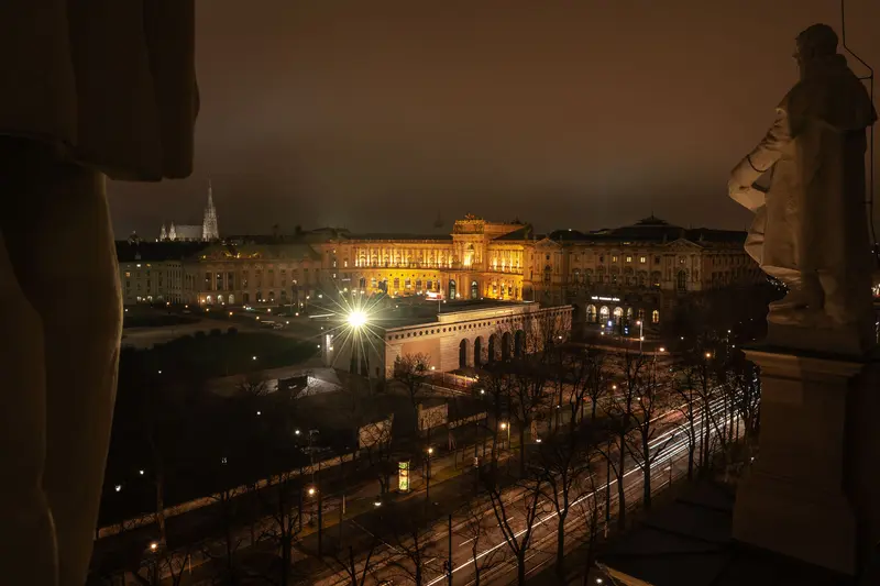 Nocturnal Cityscape of Vienna with Illuminated Historic Architecture and Architectural Fragment