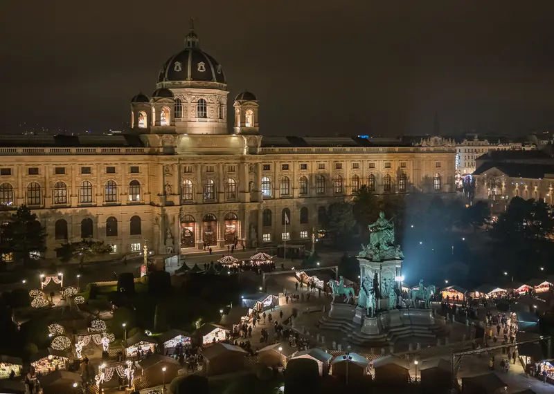 Vienna's Natural History Museum Christmas Market at Night with Illuminated Architectural Splendor