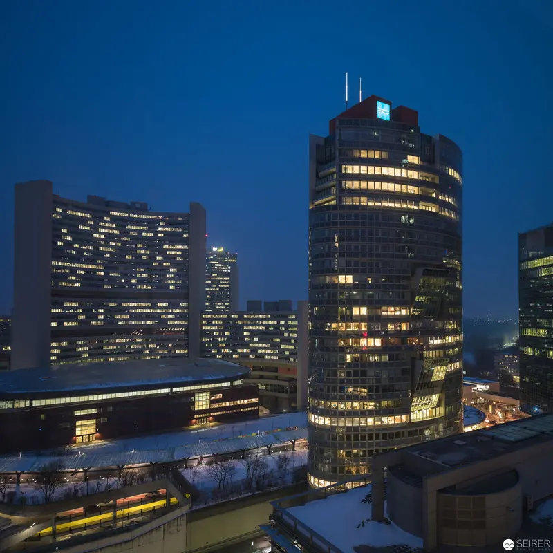 Urban Nocturne: Illuminated Corporate Towers at Twilight