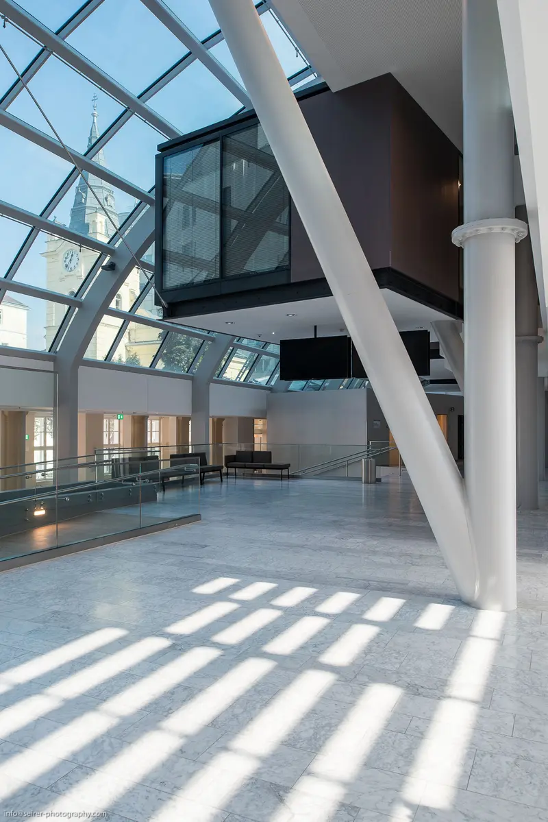 Architectural Interior with Angled Columns and Glass Curtain Wall