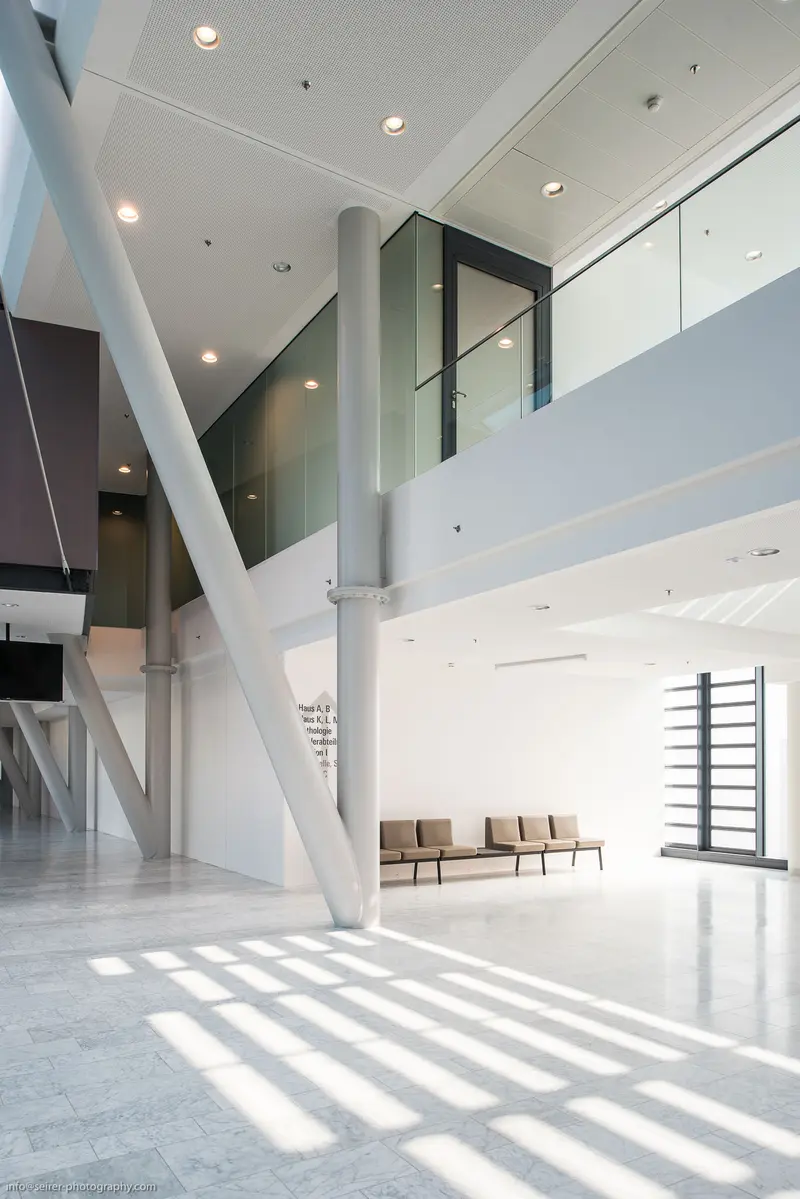 Minimalist Architectural Interior with Geometric Lighting and Suspended Spatial Volumes