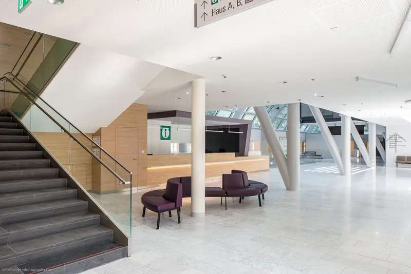 Contemporary Architectural Interior with Minimalist Reception and Sculptural Structural Elements