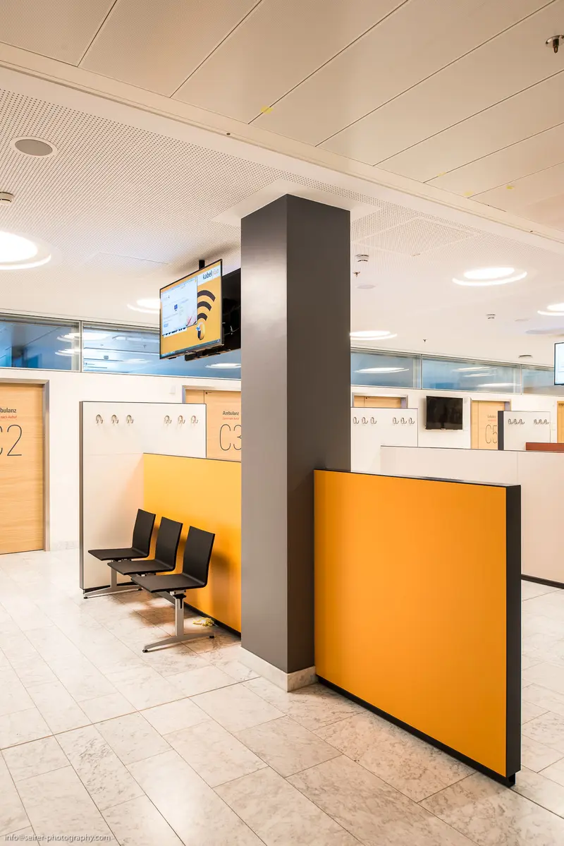 Modern Airport Check-In Area with Minimalist Orange and Gray Design