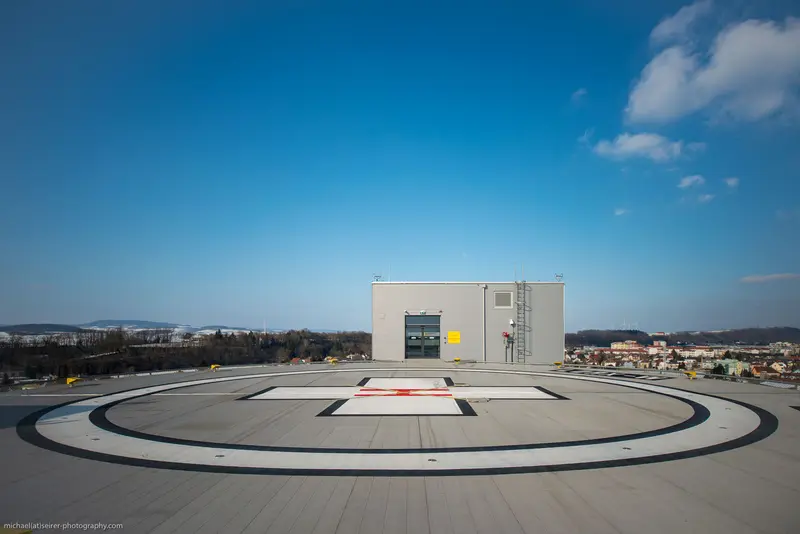 Aerial Helipad Overlooking Suburban Landscape with Modern Medical Facility