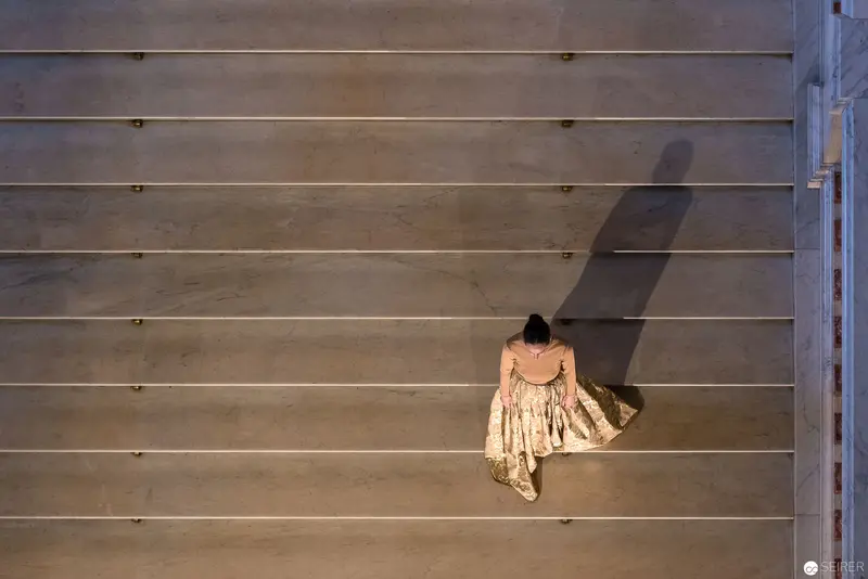 Solitary Figure in Geometric Space, Casting Elongated Shadow on Horizontal Planes