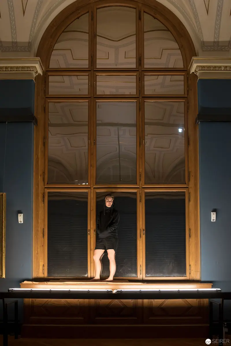 Performance of Ganymed at Kunsthistorisches Museum Wien: Solitary Figure in Arched Window