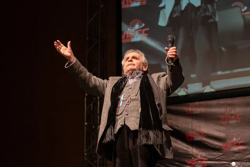 Sylvester McCoy Gesturing Dramatically at Vienna ComicCon 2018 Performance