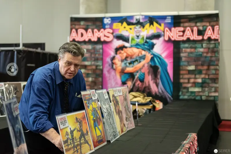Comic Book Artist Neal Adams at Signing Table with Batman Artwork