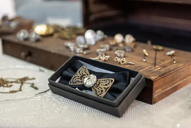 Artisan Wooden Display of Vintage Filigree Bow Tie and Decorative Jewelry Accessories
