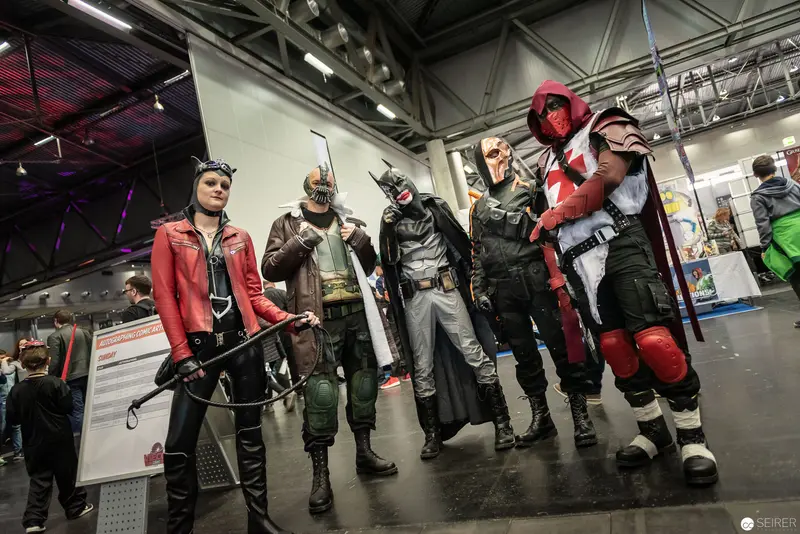 Costumed Comic Convention Performers Pose in Detailed Superhero and Villain Costumes