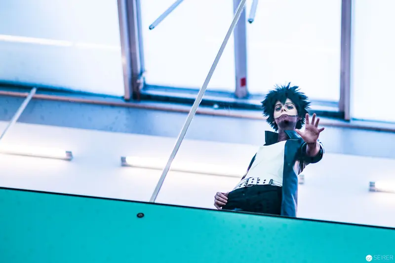 Cosplayer in White and Black Poses on Green Pool Table at VIECC 2018