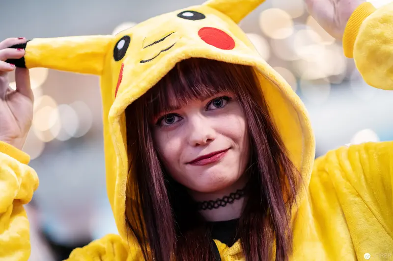 Cosplayer in Pikachu Hoodie Smiling at Vienna ComicCon 2018