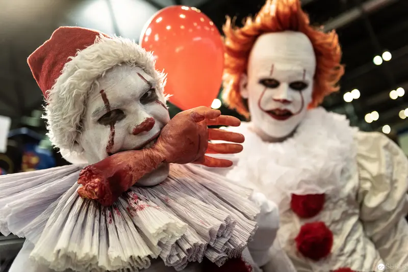 Costumed Clown Performers in Elaborate Makeup at Comic Convention