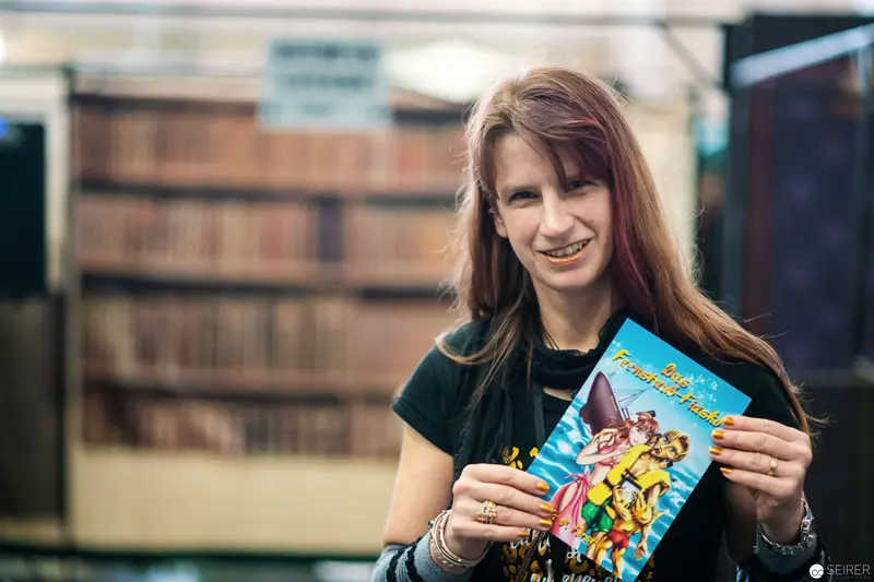 Woman Holding Comic Book at Vienna ComicCon 2018 Photographic Archive
