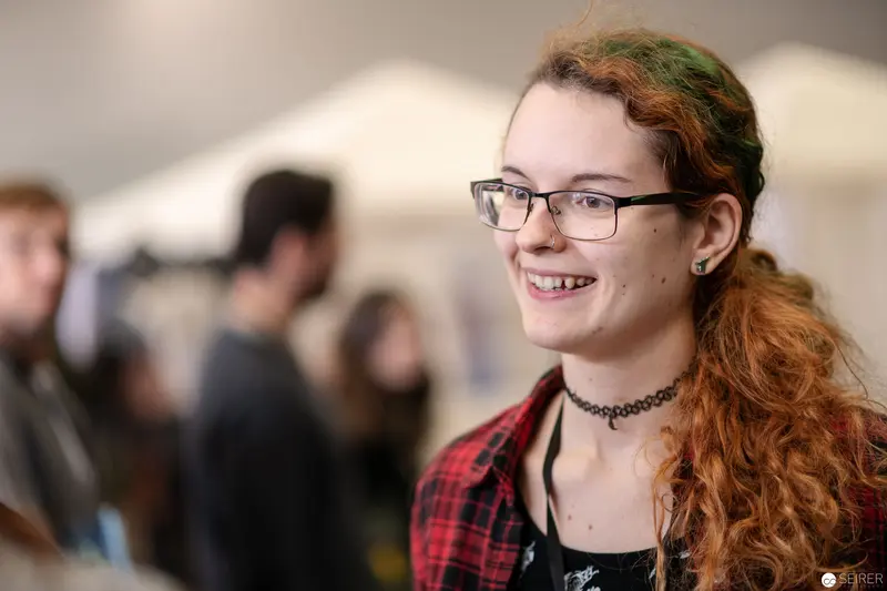Smiling Attendee in Red Plaid at Vienna ComicCon 2018