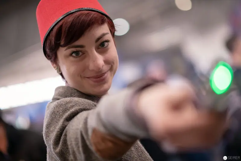 Red-Capped Subject at Vienna ComicCon 2018, Candid Moment in Convention Space