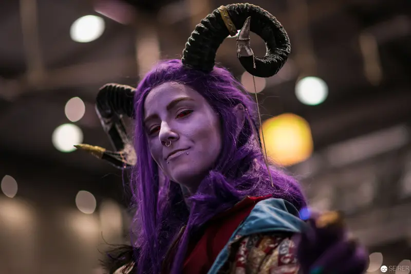 Cosplayer with Purple Hair and Ram Horns at Vienna ComicCon 2018