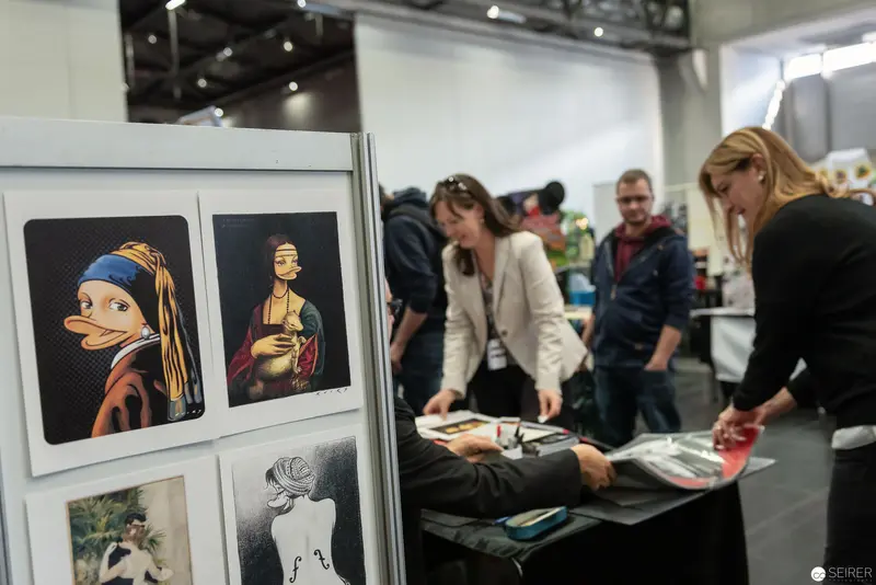 Art Exhibition Visitors Examining Reimagined Classic Painting Interpretations at VIECC 2018