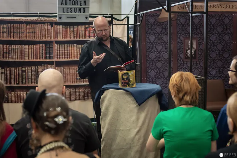 Author Reading at Vintage Book-Lined Library During Literary Event