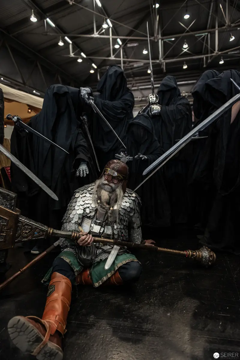 Costumed Performer Surrounded by Hooded Figures at Vienna ComicCon 2018