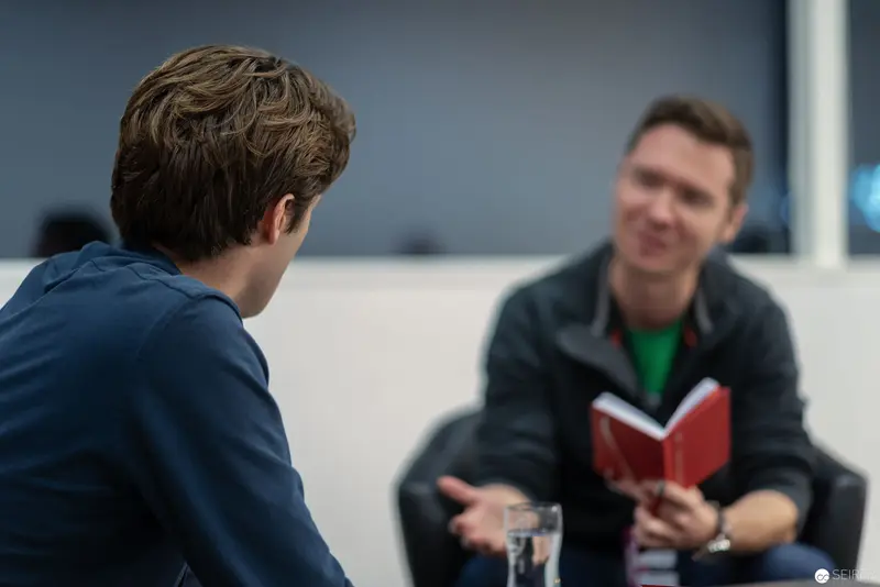 Two Men in Conversation during Interview or Meeting Setting
