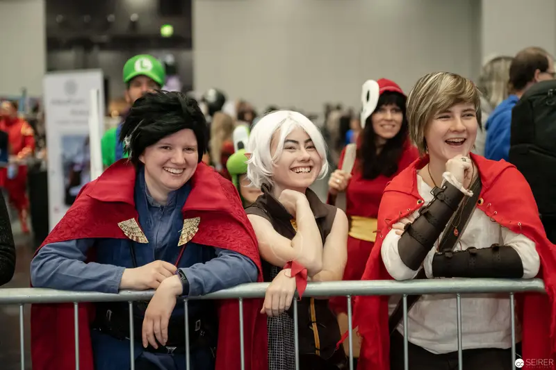 Cosplay Enthusiasts at Vienna ComicCon 2018 Leaning on Crowd Barrier