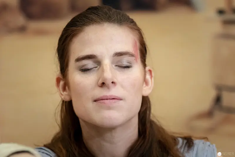 Serene Contemplation: Woman with Closed Eyes in Meditative Pose