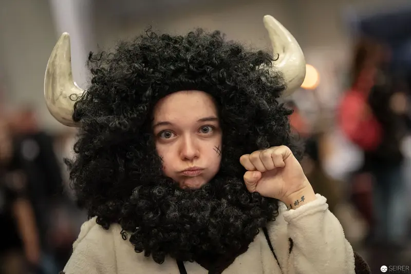 Viking Cosplayer in Curly Wig and Horns at Vienna ComicCon 2018